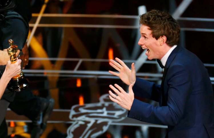 Actor Redmayne reacts as he takes the stage to accept the Oscar for best actor for his role in "The Theory of Everything" during the 87th Academy Awards in Hollywood
